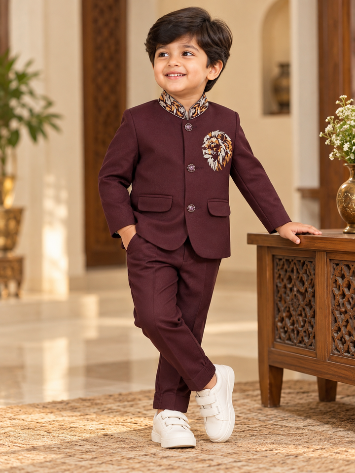 Boys maroon lion embroidered bandhgala suit set with patterned collar and matching pants